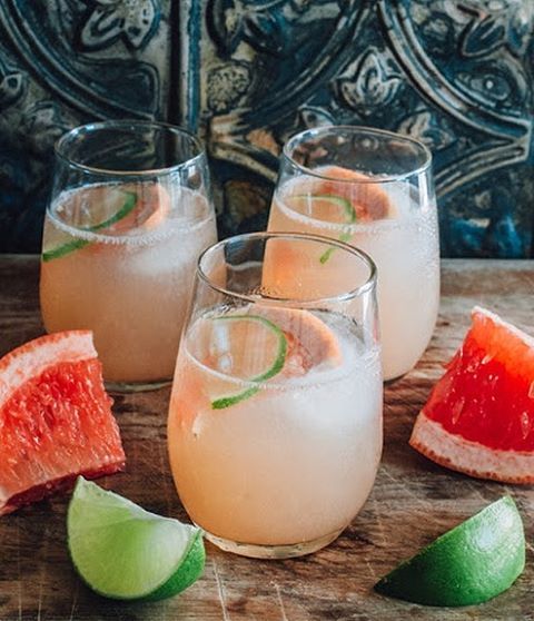 Zero-proof paloma with fresh grapefruit, lime and a salted rim in a tall glass