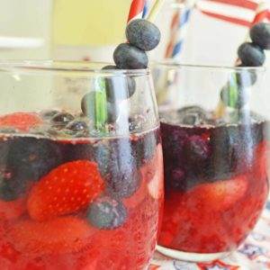 red white & berry sangria with strawberries and blueberries.