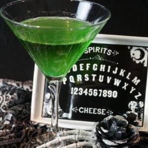 The Spirit Summoner Cocktail predicts you'll have a great Halloween. Fortune teller hand with ouija board