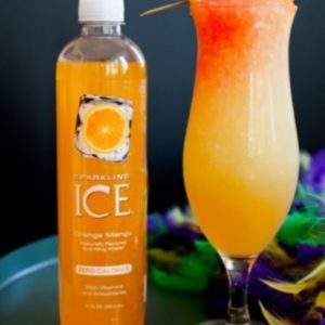 Hurricane Snow Cone Recipe perfect for Mardi Gras. The drink is served here in a classic hurricane glass with mardi gras feathers on a platter. Also shown is a bottle of orange mango flavored Sparkling Ice.