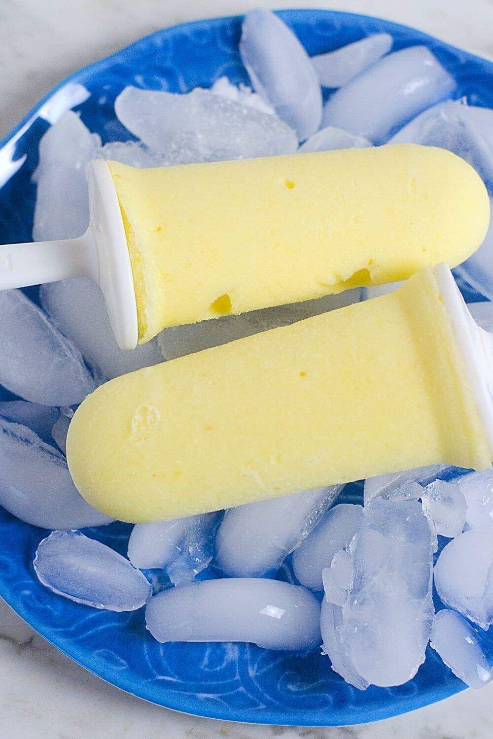 https://champagneandcoconuts.com/wp-content/uploads/2019/07/Pineapple-Dole-Whip-Popsicles-with-Rum.jpg